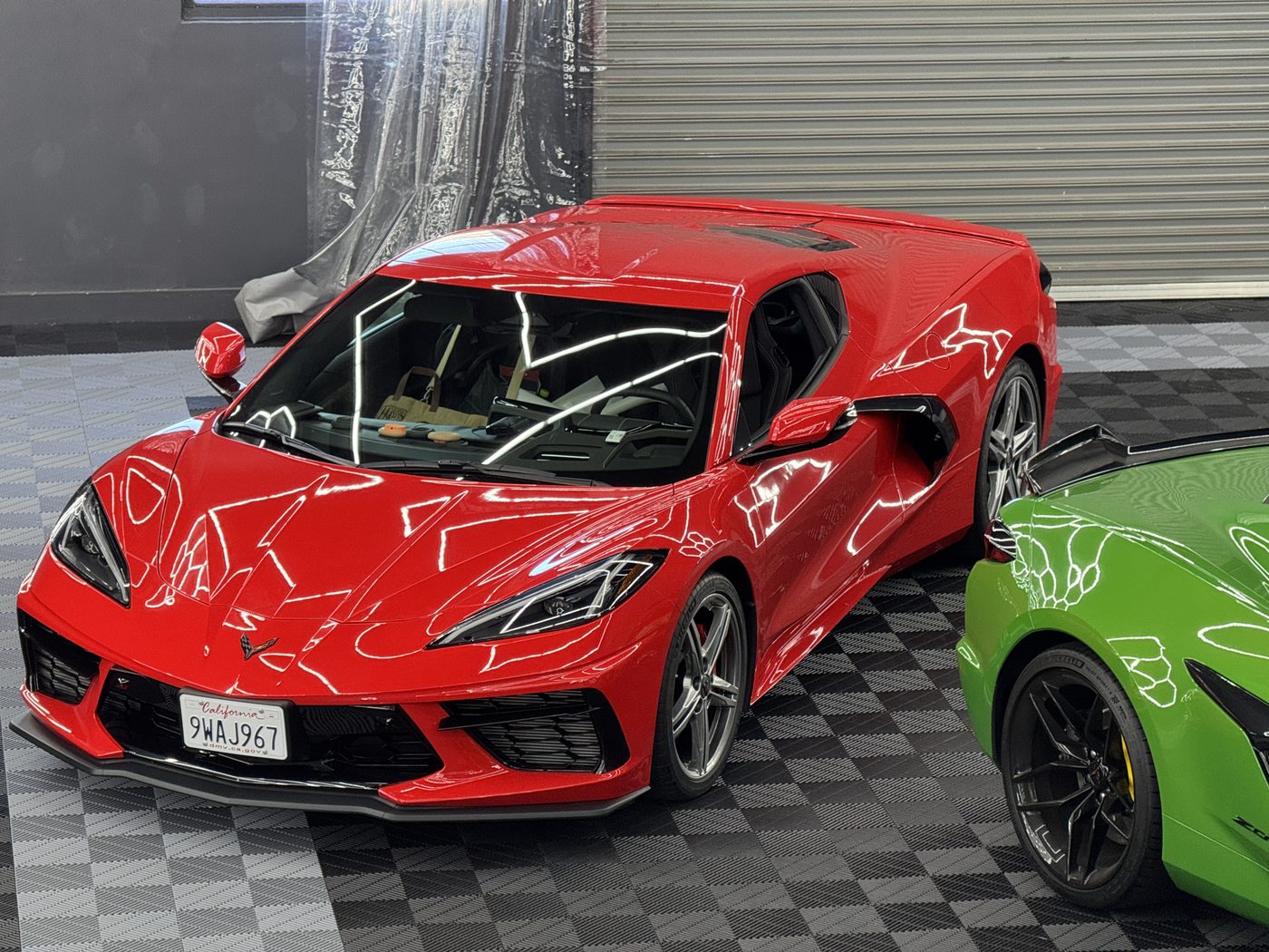 Red and green Corvettes