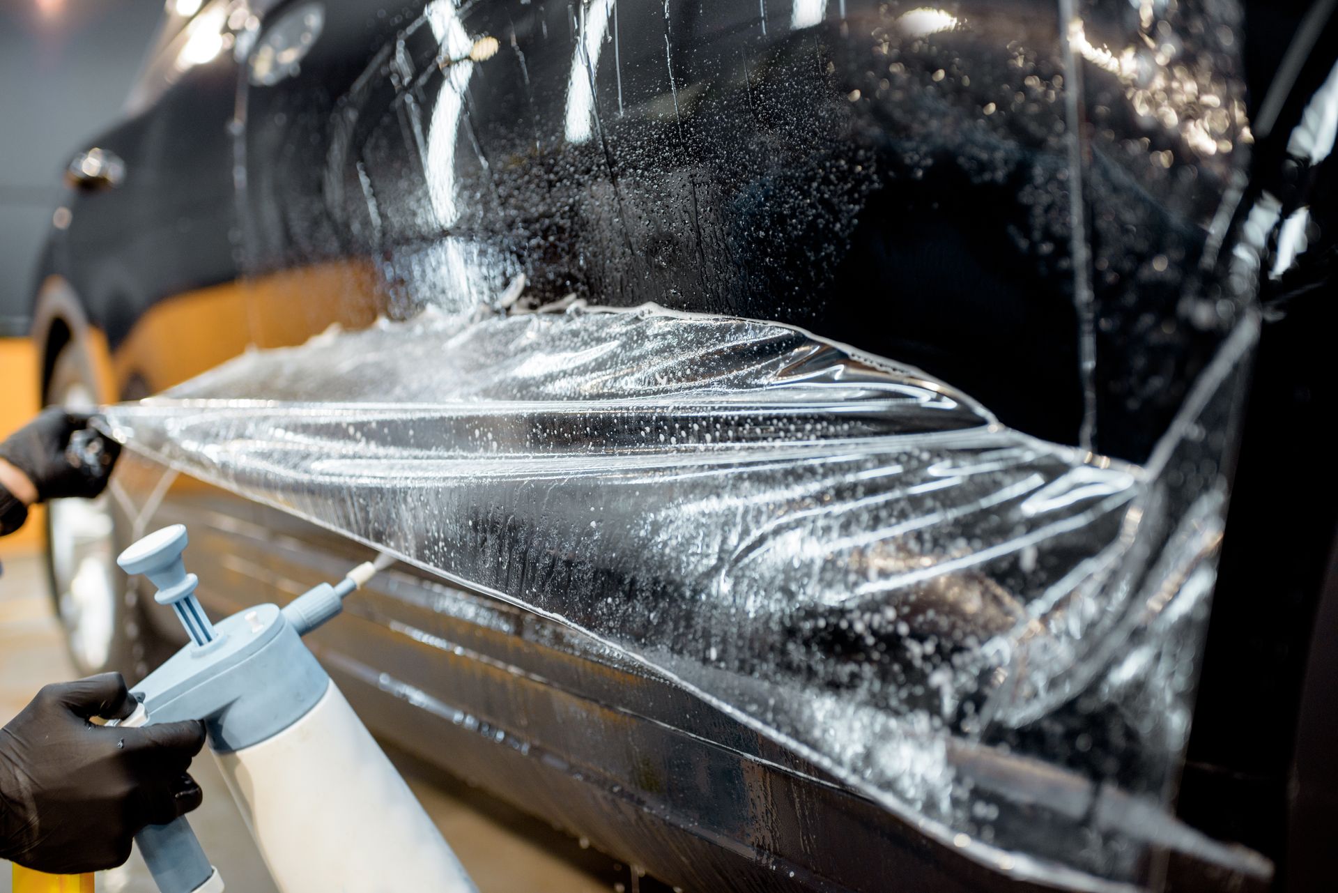 Paint protection film installation on car at Auto Xpert Belmont